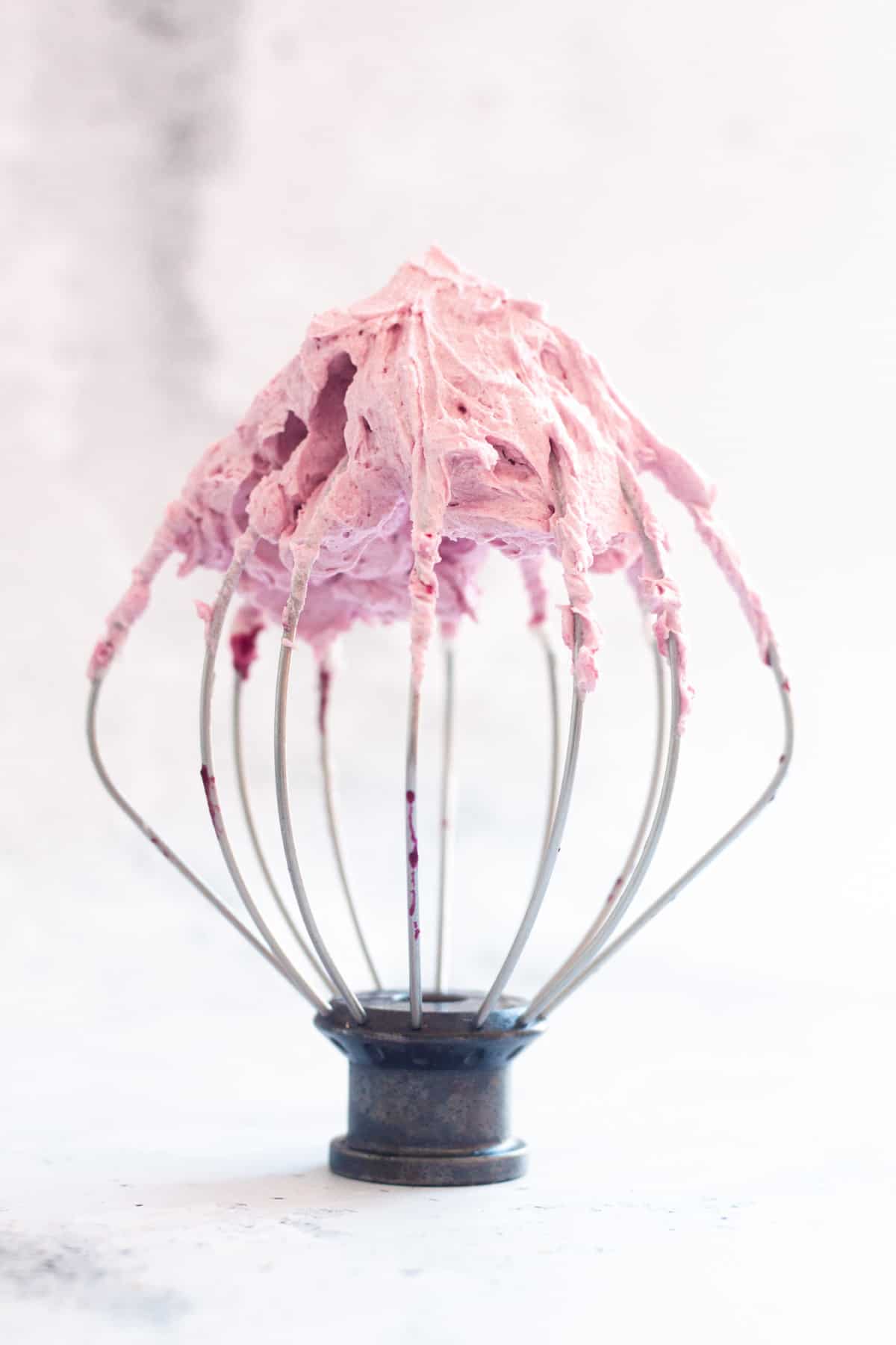 blueberry frosting on whisk
