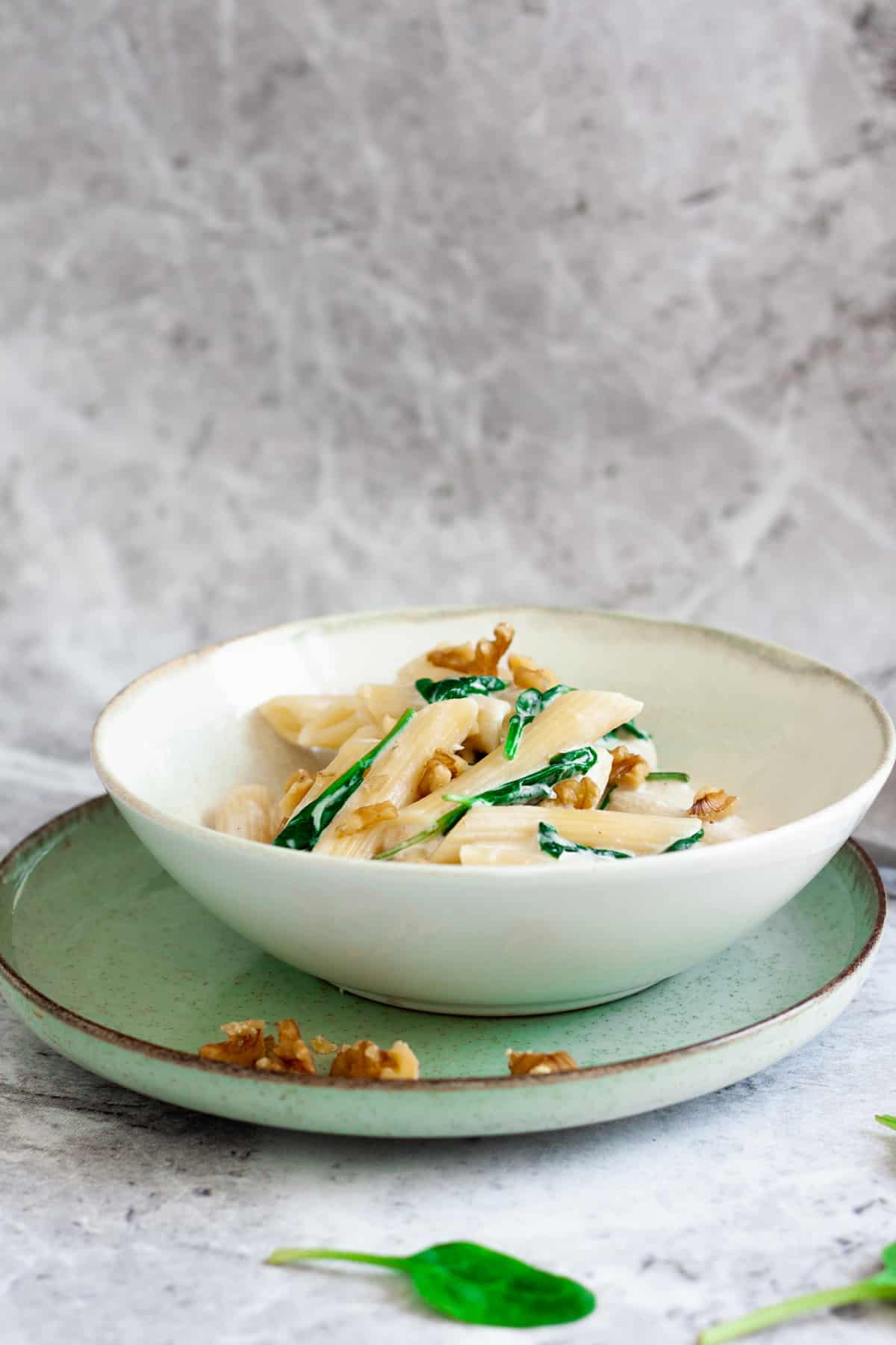 plate of creamy spinach and walnut pasta