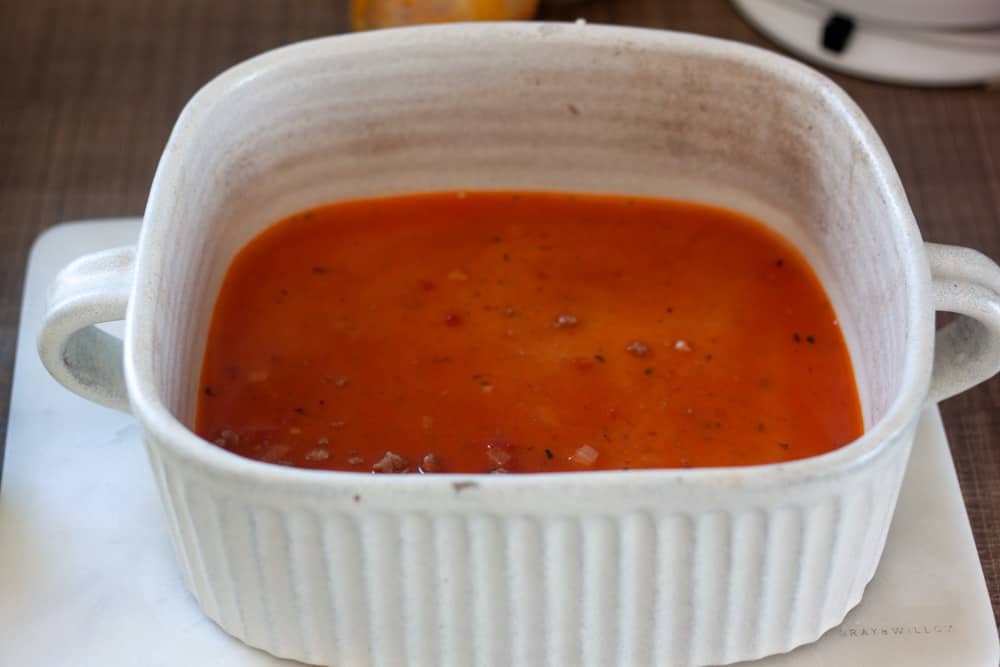 cover the base of your baking pan with a thin layer of water and tomato sauce.