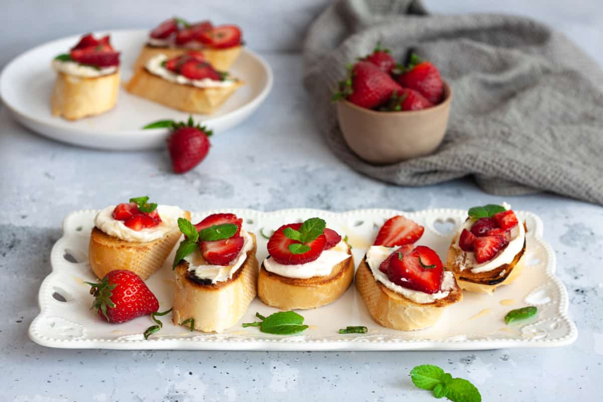 strawberry mascarpone bruschetta on white tray