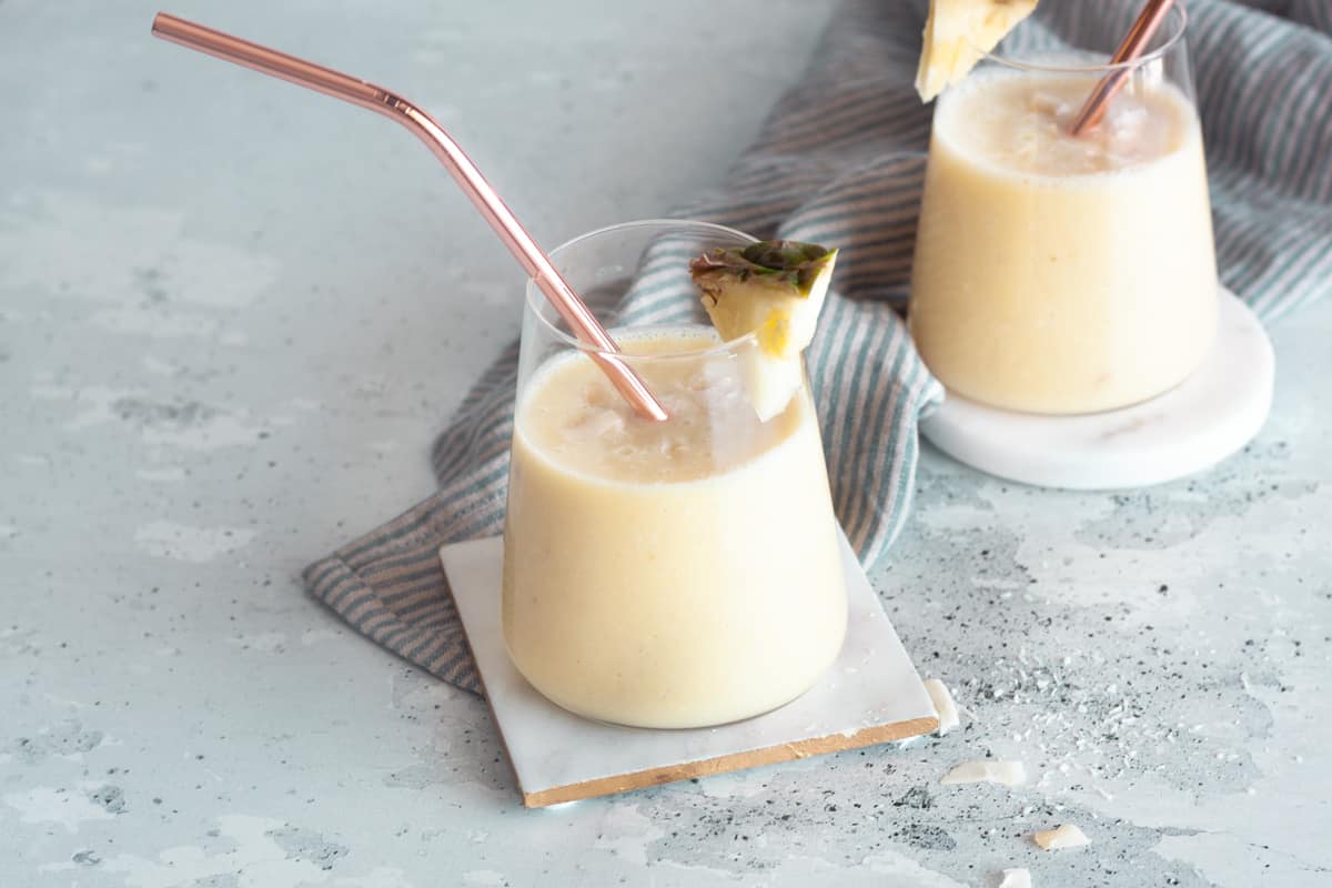 two servings of banana pineapple smoothie