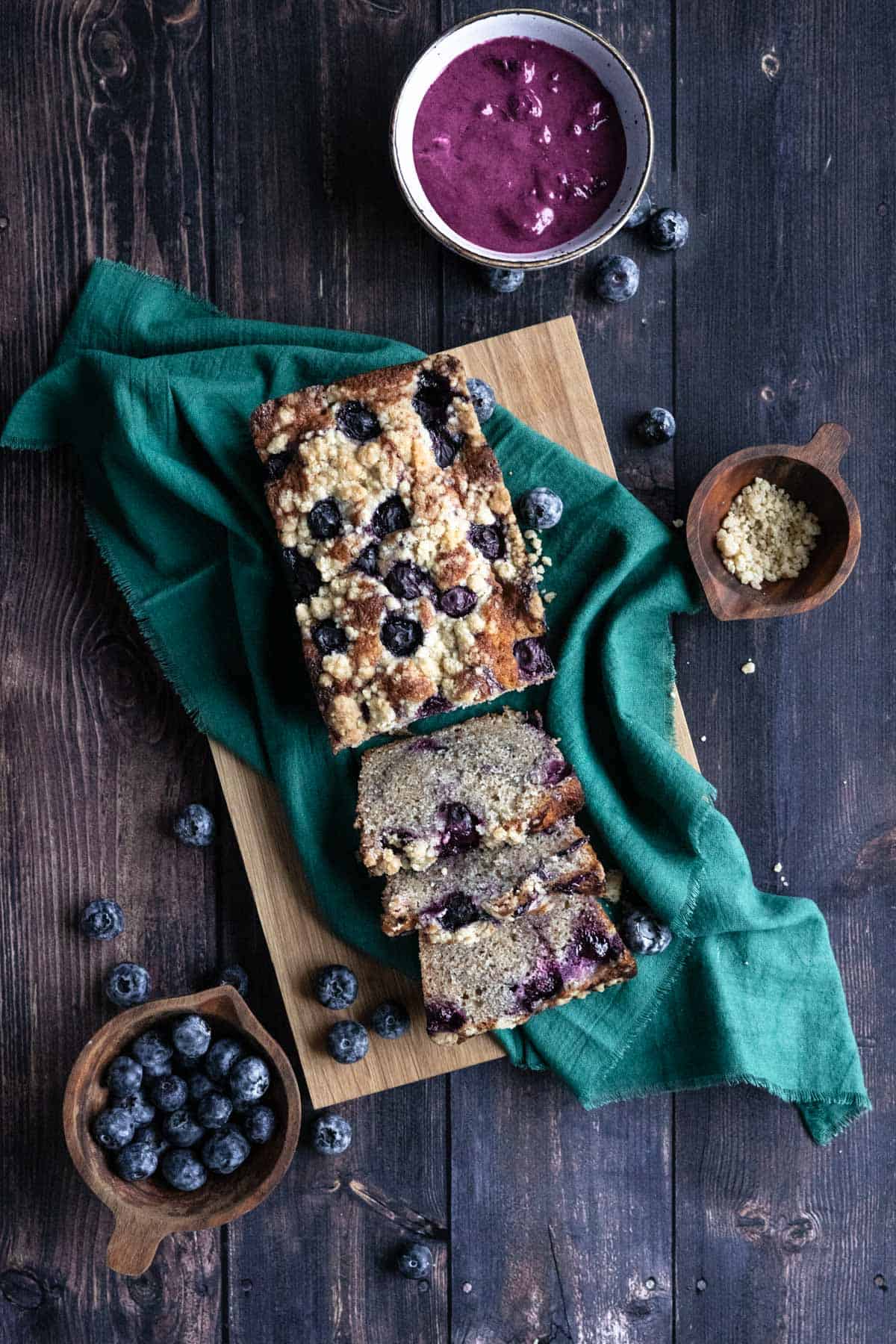 Blueberry Cream Cheese Loaf Cake on a green teacloth
