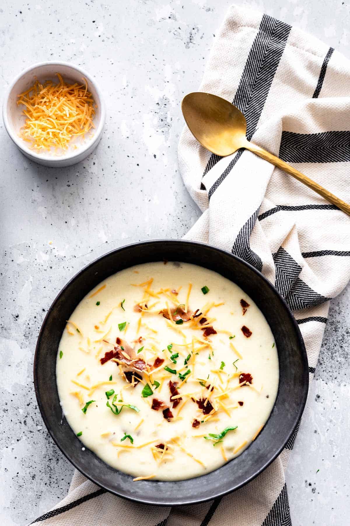a serving of of 4 Ingredient Potato Soup in a black plate