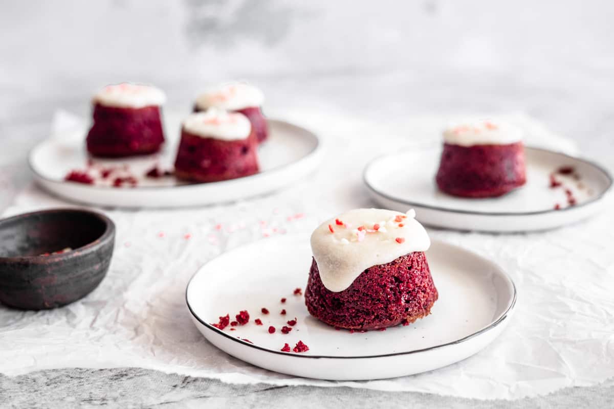 red velvet mini cakes drizzled with cream cheese glaze