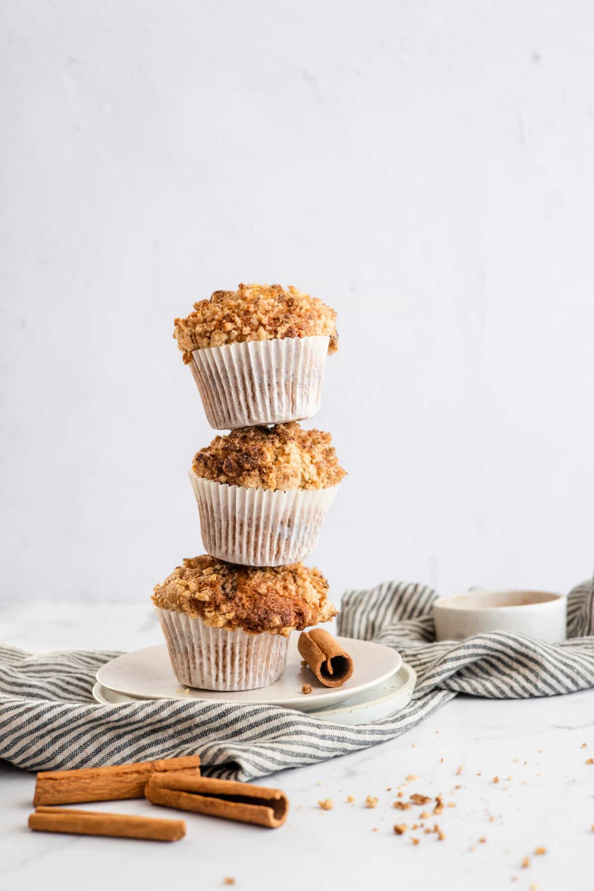 a stack of cinnamon streusel muffins.