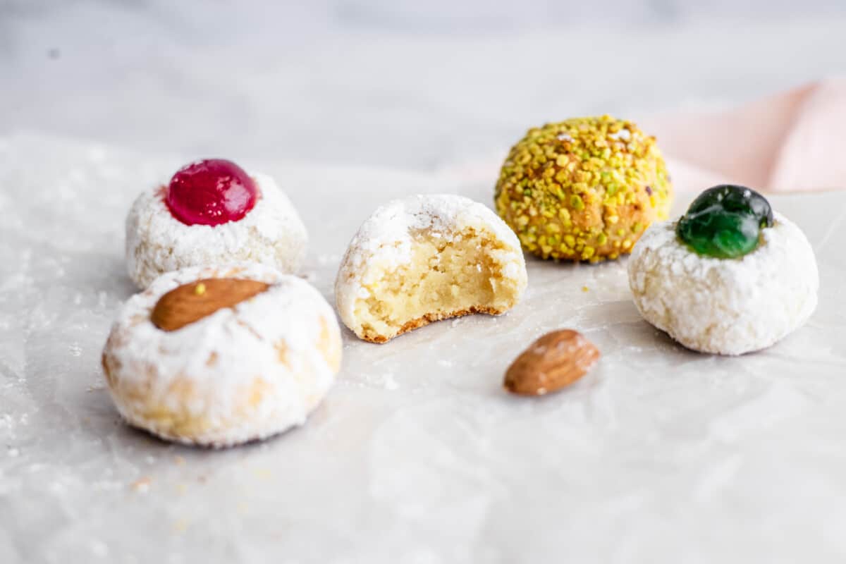 Five Italian almond cookies on white background