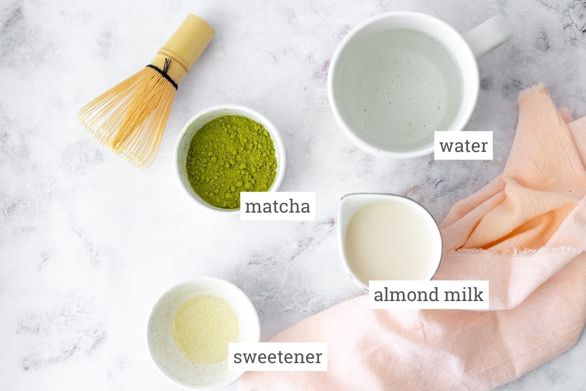Ingredients for almond milk matcha latte: matcha, water, sweetener, and almond milk.